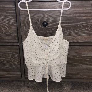 white and green patterned tank top